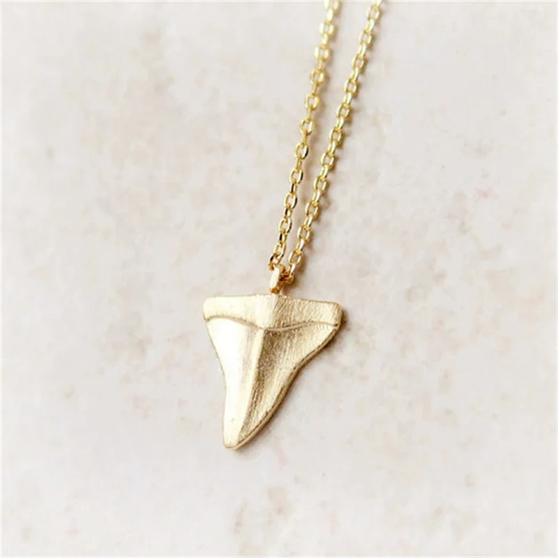 Gold shark tooth necklace